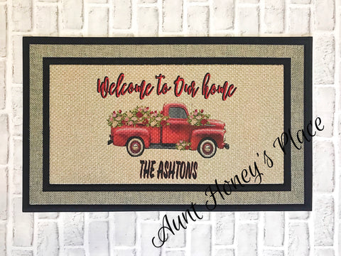 Welcome to our Home. ..red truck with flowers doormat